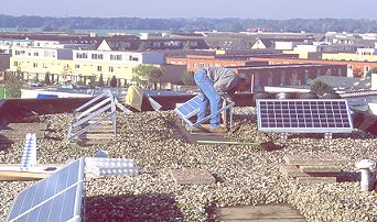 rush hour on the flat roof on October 12 2001: installation of two new 648 Wp PV-systems