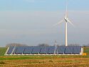 Detailed view of complete PV-plant with one of the five 1,5 MW General Electric  wind turbines.The "hole" on the left is the result of brutal theft, under police investigation.