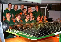 Proud Twente University's student Solar Team in front of "their" Solutra racing car, high-end candidate for a victory in Australia's World Solar Challenge race, september 2005.